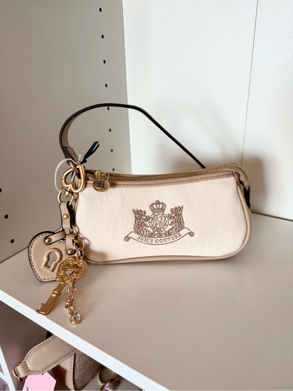Juicy Couture “Royal To Juicy” Cream Leather Logo Key Charm Wristlet